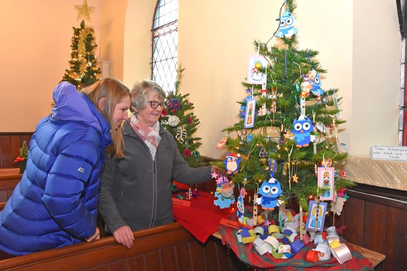 Visitors admiring the tree decorations in the Methodist Church