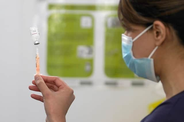 A pharmacist prepares to administer the Covid-19 vaccine. (Photo by Christopher Furlong/Getty Images)