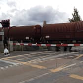 A freight train covers the Sleaford Road level crossing.