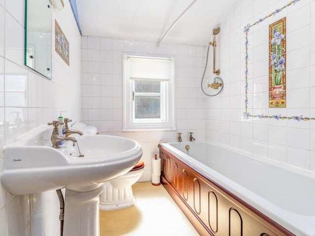 The Jack and Jill style bathroom, with a door leading to one of the bedrooms and another to the landing.