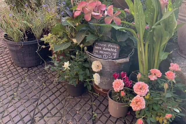 Plants left in tribute to the Queen on her death have been transplanted to the garden at Mrs Smith's Cottage, Navenby.