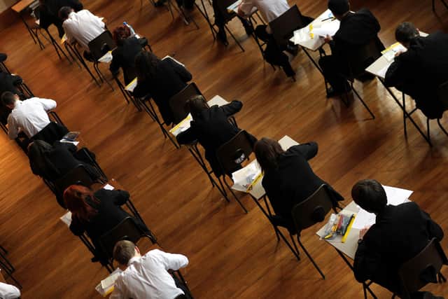 File photo dated 02/03/2012 of a exam in progress. Bedales School a private school in Hampshire is cutting the number of GCSEs pupils can take because the qualification is "outdated" and not fit for purpose, the headteacher Will Goldsmith has said.