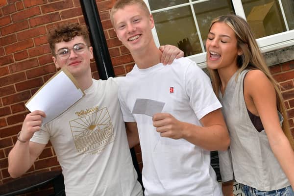 QEGS A Level students receive their results, from left: Archie Head, Cameron Ball, and Tyla Burton.