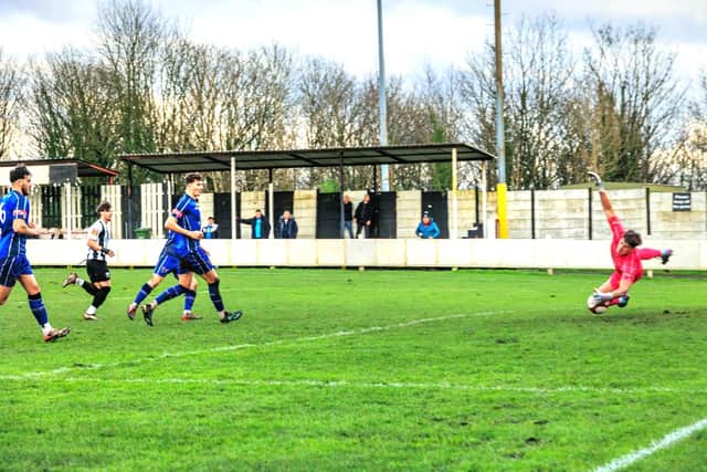 Dylan Wharton denies Atherton's Jordan Scanlon. Photo by David Featherstone (ACFC).