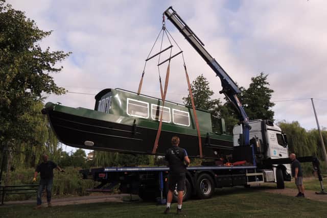 Lift off - the Benjamin Handley is hoisted aloft by crane from the lorry it arrived on.