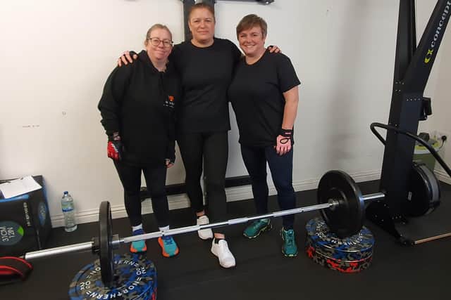 L-R - Claire Asbery, Mel Parker and Sam Smith were each deadlifting 100 tonnes in 24 hours.