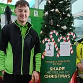 Asda colleagues with the special gift appeal trolley at the Boston store.