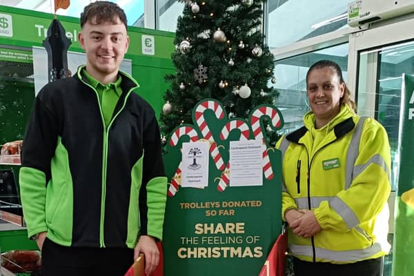 Asda colleagues with the special gift appeal trolley at the Boston store.