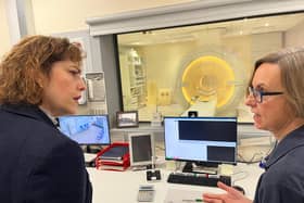 Sally May, radiographer at Louth County Hospital, shows Victoria Atkins MP the new MRI scanner.