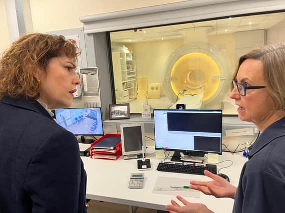 Sally May, radiographer at Louth County Hospital, shows Victoria Atkins MP the new MRI scanner.