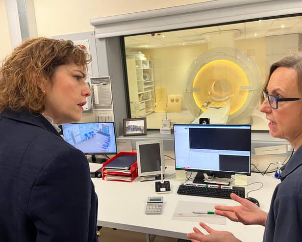 Sally May, radiographer at Louth County Hospital, shows Victoria Atkins MP the new MRI scanner.