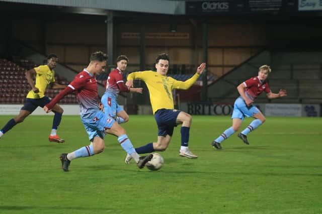 Scunthorpe United's youngsters pipped Gainsborough Trinity to lift the Lincs Senior Trophy, but the first team were relegated from League Two.