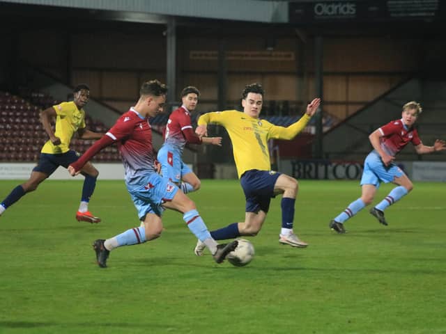Scunthorpe United's youngsters pipped Gainsborough Trinity to lift the Lincs Senior Trophy, but the first team were relegated from League Two.