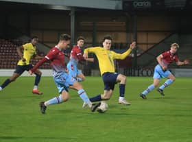 Scunthorpe United's youngsters pipped Gainsborough Trinity to lift the Lincs Senior Trophy, but the first team were relegated from League Two.