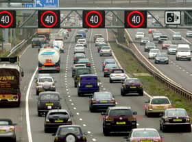 Motorists drive on the hard shoulder of one of the busiest stretches of motorway in Britain between junctions 3 and 7 of the M42