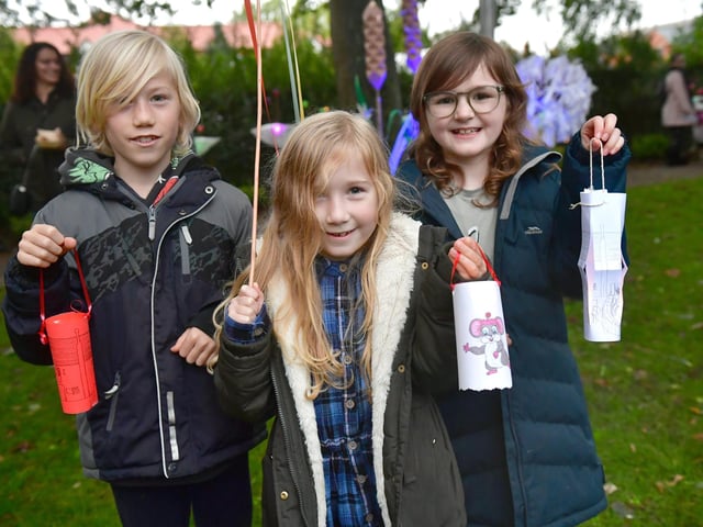 L-R George Braniff 10, Anne Braniff 7, and Matilda Hawkins 9 of Sleaford show off their lanterns.