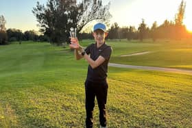 Woodhall Spa golfer Harry Camm (13) shows off his trophy.