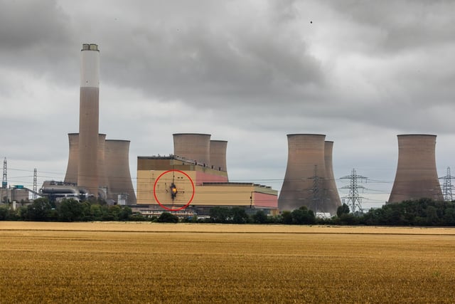 You can see a small flash of flame erupting from the turbine hall during the demolition of Cottam Power Station