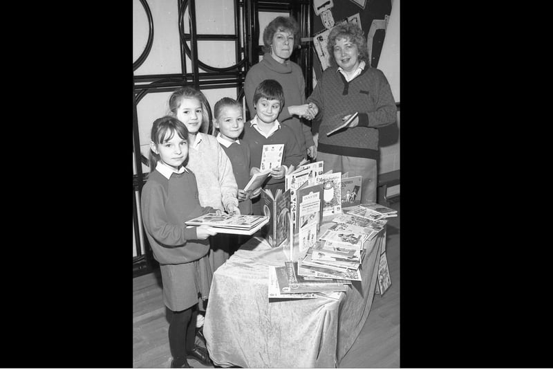 Boston's Staniland School was among those in the area to be receiving books after parents, children and staff collected tokens in a scheme run by WH Smith. Teacher Elizabeth Harwood, left, is pictured receiving the reading materials from Jane Keightley, of WH Smith. The children pictured are, from left, Keri Taylor, Gemma Salter, Keeley Dawson and Ian Stones.