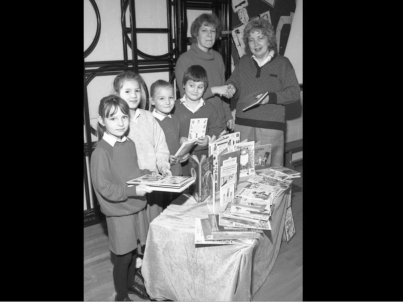 Boston's Staniland School was among those in the area to be receiving books after parents, children and staff collected tokens in a scheme run by WH Smith. Teacher Elizabeth Harwood, left, is pictured receiving the reading materials from Jane Keightley, of WH Smith. The children pictured are, from left, Keri Taylor, Gemma Salter, Keeley Dawson and Ian Stones.