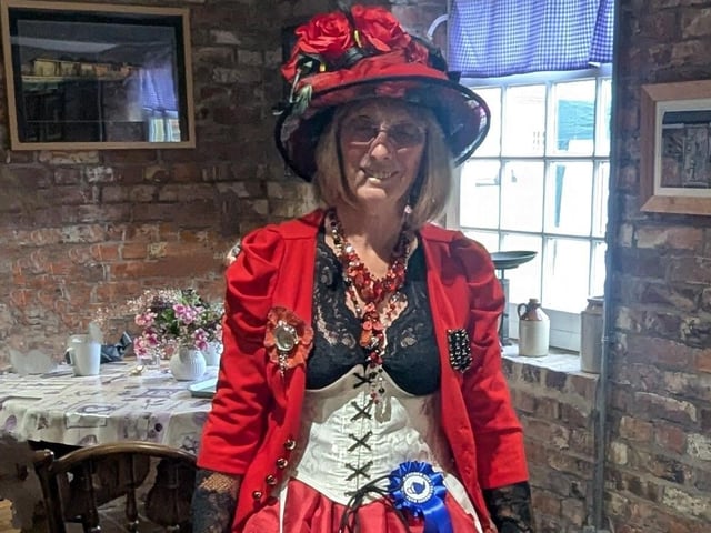 Queen of Hearts overseeing the Event with approval