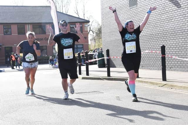 Victoria at the finish, with running partner Lewis. Picture: www.charleswhittonphotography.com