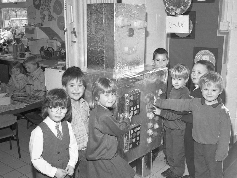 Youngsters at Kirton Primary School with their creation Reggie the Robot. Boxes, egg cartons, plastic pots, lids and a healthy support of tin foil all played a part in Reggie's construction. Reggie was set to feature at Boston's annual science and technology fair, along with some smaller models being made by the children.