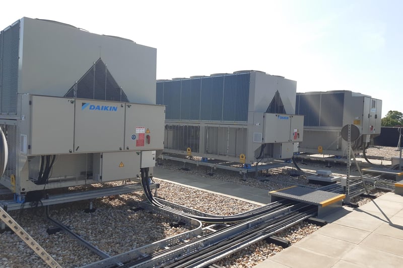 The new building uses air source heat pumps and is carbon neutral. These are located on the roof of the two-storey building.