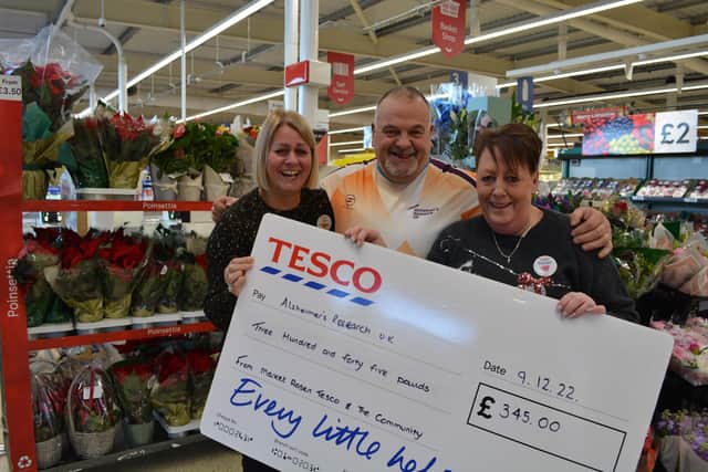 Steve Boryszczuk was presented with the donation by Jen Allmond, left, and Rachael Bell