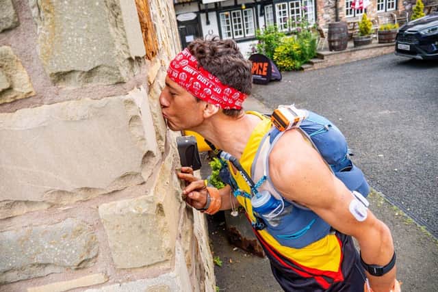 Planting a kiss at the Border Hotel, in Kirk Yetholm, at the end of the race.