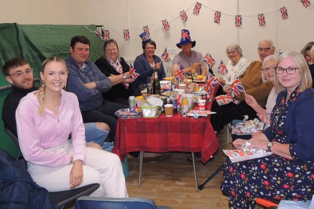 Families enjoying a jubilee picnic in Rauceby village hall on Sunday.