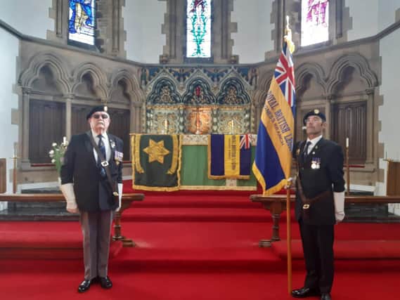 Former chairman of the Skegness branch of the Royal British Legion Les Constantine performs his final duty for the  Skegness and Mablethorpe  branch of the Burmar Star Association as their Standard is laid up. Kevin Woolley carries the new Standard of the Skegness branch of the Royal British Legion.