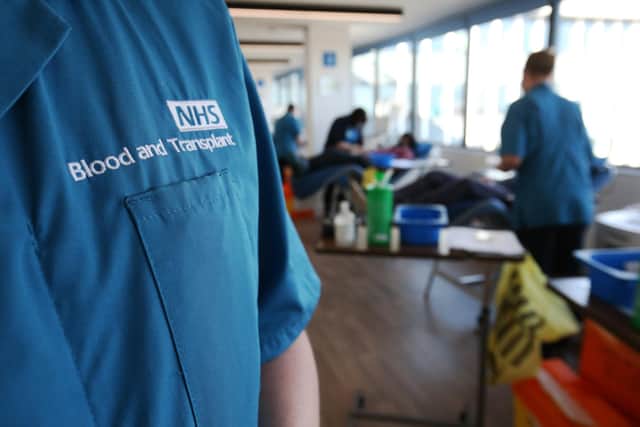 A donor carer's branded uniform at the Twickenham Donor Centre, south-west London, after a ban on the procedure was lifted in February. The ban was originally imposed in 1998 amid concerns about the spread of a human variant of BSE – dubbed "mad cow disease" – known as Creutzfeldt Jakob Disease. Picture date: Wednesday April 7, 2021. PA Photo. The plasma will be fractionated and used to make antibody-based medicines, called immunoglobulins, for people with rare immune diseases. NHS Blood and Transplant will from today take donations at 14 donor centres around England for an initial three months. Thousands of patients rely on immunoglobulin medicines for short-term or lifelong diseases and genetic disorders. See PA story HEALTH Plasma. Photo credit should read: Jonathan Brady/PA Wire