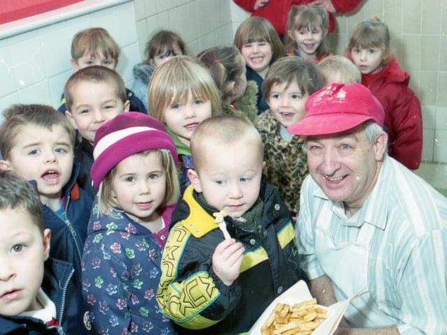 Staniland Nursery School paying a visit to Chips and Things, in Woodthorpe Avenue, as part of their 'looking at things' project. James Quin cooked up a few chips for the onlooking crowd to taste.