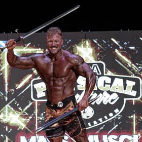 Boston gym owner Tom Chenery with his sword trophy following success at the PCA USA Mass Muscle contest in Massachusettes. Picture: Alex Breezy (BR3ZZY)