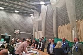 Skegness area councillors keep a watchful eye over the election count for East Lindsey.