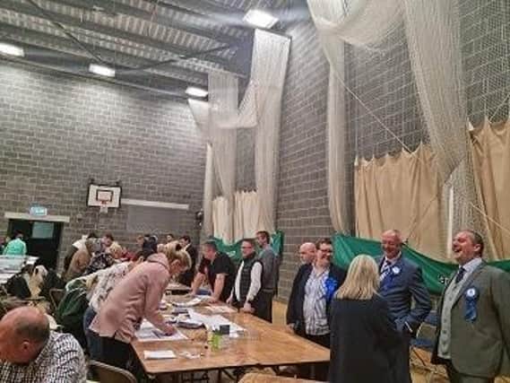 Skegness area councillors keep a watchful eye over the election count for East Lindsey.