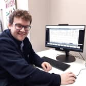 Delving into the archives, Boston Library's senior library assistant Ed Robinson.