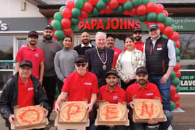 Mayor of Sleaford Coun Antony Brand joins Simran, Sukhy and Kam Bains and staff at the opening of the new Papa Johns takeaway pizza store in Sleaford.
