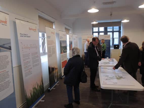 Residents consider the plans for the Springwell Solar Farm in Blankney Old School.