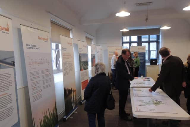 Residents consider the plans for the Springwell Solar Farm in Blankney Old School.