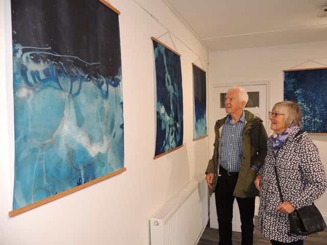 Bob and Wendy Oldershaw of Sleaford admire the Water Mark exhibition at the Carre Gallery during RiverLight Festival.