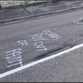 Some of the witty graffiti which highlighted the state of Ermine Street in Ancaster, prior to the repair works.