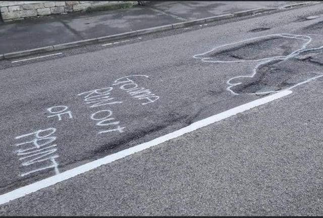 Some of the witty graffiti which highlighted the state of Ermine Street in Ancaster, prior to the repair works.
