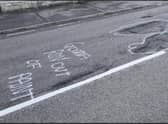 Some of the witty graffiti which highlighted the state of Ermine Street in Ancaster, prior to the repair works.