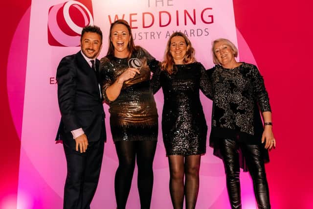 Michelle Roworth (second from left), owner of the Horncastle-based florist and events business, Rosedale House, picks up her award. (PHOTO BY: The Wedding Industry Awards)