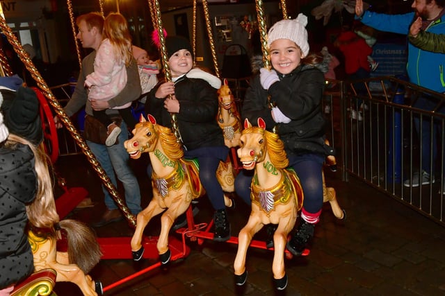 Enjoying some fairground fun are Paris Steer, five, and Kendall Steer, six, of Boston