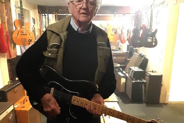 Norman holding Gary Kemp's guitar.