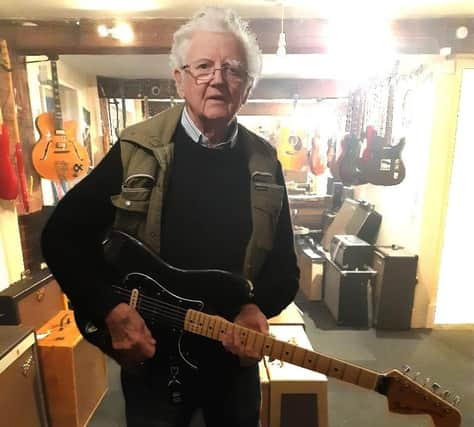 Norman holding Gary Kemp's guitar.