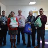Nicholsons directors Richard Hallsworth, Kate Brown and Steve Robinson delivered items to the New Life Food Bank